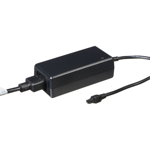 AJA KUMO PWR power supply module for KUMO routers, compact external unit with locking power connector, designed for redundancy and reliability.