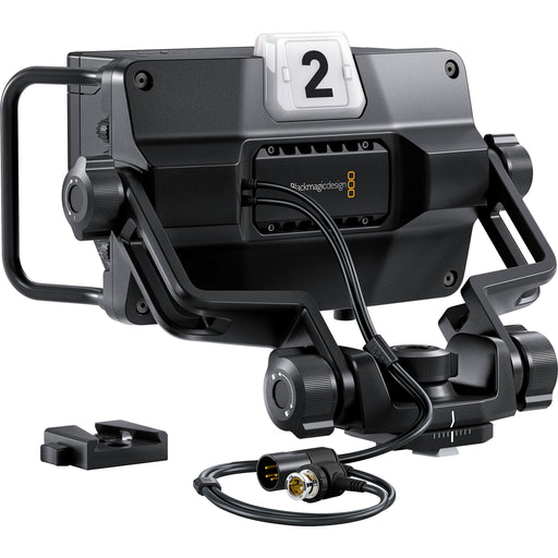 The Blackmagic Design URSA Studio Viewfinder G2 (CINEURSANSVF2) is a 7-inch, 1920x1200 high-brightness monitor for URSA Studio and Mini cameras. It features a detachable sun hood, side handles, SDI input, and customizable controls for professional studio use.