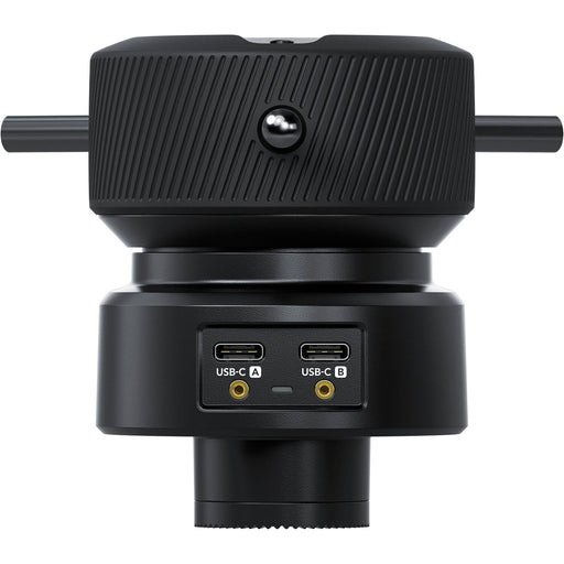 The Blackmagic Design Focus Demand (CINSTUDMFT/H/FD) is a precision focus control for Blackmagic Studio Cameras. It features a rotating knob with three levers, dual USB-C ports for daisy-chaining, and an ARRI-style rosette mount for tripod handles. Customizable buttons allow quick access to camera functions, enhancing efficiency in live productions.
