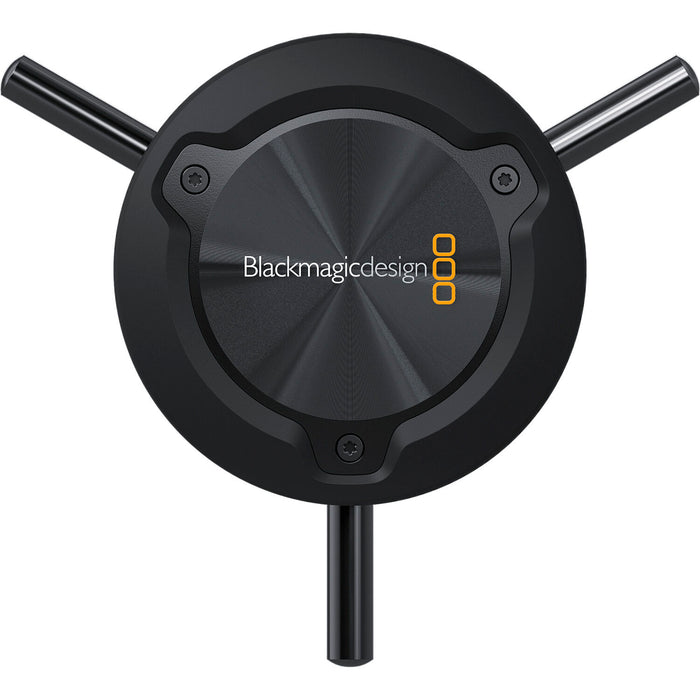 The Blackmagic Design Focus Demand (CINSTUDMFT/H/FD) is a precision focus control for Blackmagic Studio Cameras. It features a rotating knob with three levers, dual USB-C ports for daisy-chaining, and an ARRI-style rosette mount for tripod handles. Customizable buttons allow quick access to camera functions, enhancing efficiency in live productions.