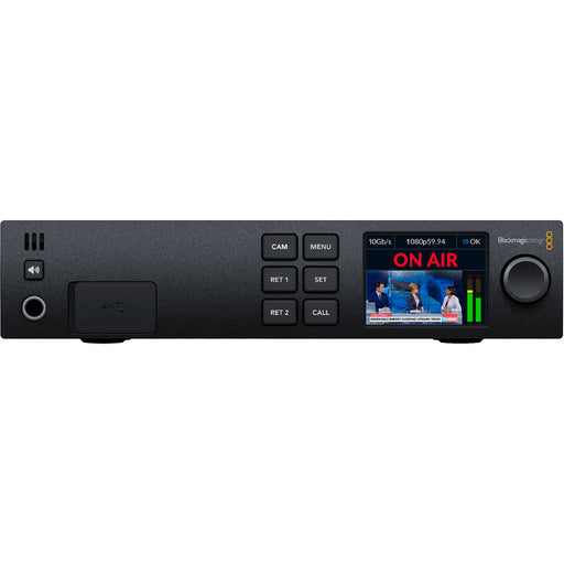 The Blackmagic Design Zoom Demand (model CINSTUDMFTHSC) is a control device designed for Blackmagic Studio Cameras. It offers precise zoom control with an in/out toggle and speed selection knob. The device connects via dual USB-C ports and mounts on the camera's pan handle using a rosette, allowing for flexible positioning. It is compatible with Blackmagic Studio Camera 4K Plus and 4K Pro models.
