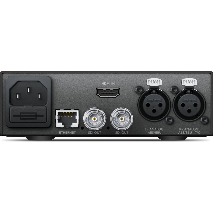 The Blackmagic Design Teranex Mini HDMI to SDI 12G Converter is a compact, rectangular device with a matte black finish. The front panel features a USB port and ventilation grilles, while the rear panel includes an HDMI input, two 12G-SDI outputs, an Ethernet port, and XLR audio inputs. This design facilitates professional video and audio signal conversion in broadcast and post-production environments.