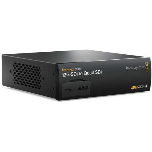 The Blackmagic Design Teranex Mini 12G-SDI to Quad SDI Converter is a compact, rectangular device with a matte black finish. The front panel features a USB port and ventilation grilles, while the rear panel includes a 12G-SDI input, a 12G-SDI loop output, four 3G-SDI outputs, an Ethernet port, and a standard IEC power input. This design facilitates the conversion of a single 12G-SDI signal into four 3G-SDI outputs, enabling compatibility with equipment that utilizes Quad-Link SDI connections.