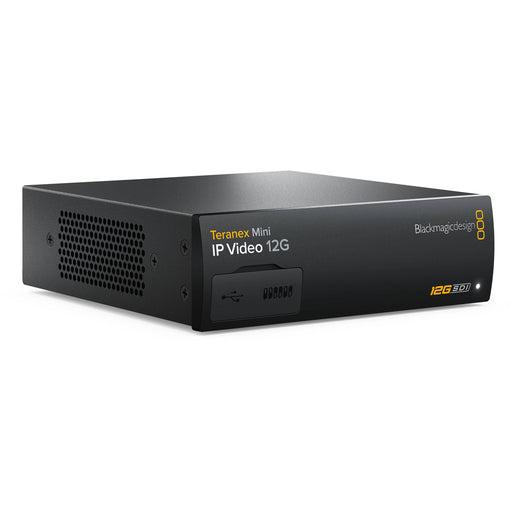 The Blackmagic Design Teranex Mini IP Video 12G Converter is a compact, rectangular device with a matte black finish. The front panel features a USB port and ventilation grilles, while the rear panel includes a 12G-SDI input, two 12G-SDI outputs, a Gigabit Ethernet port, an SFP+ cage for optional 10G Ethernet modules, and a standard IEC power input. This design facilitates bi-directional conversion between 12G-SDI signals and IP video streams, supporting video formats up to DCI 4K at 60p. 