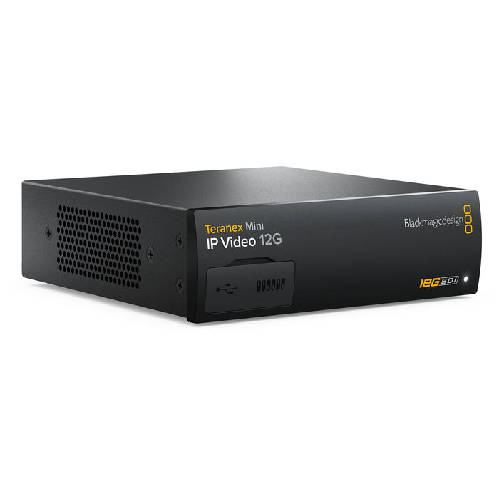 The Blackmagic Design Teranex Mini IP Video 12G Converter is a compact, rectangular device with a matte black finish. The front panel features a USB port and ventilation grilles, while the rear panel includes a 12G-SDI input, two 12G-SDI outputs, a Gigabit Ethernet port, an SFP+ cage for optional 10G Ethernet modules, and a standard IEC power input. This design facilitates bi-directional conversion between 12G-SDI signals and IP video streams, supporting video formats up to DCI 4K at 60p. 