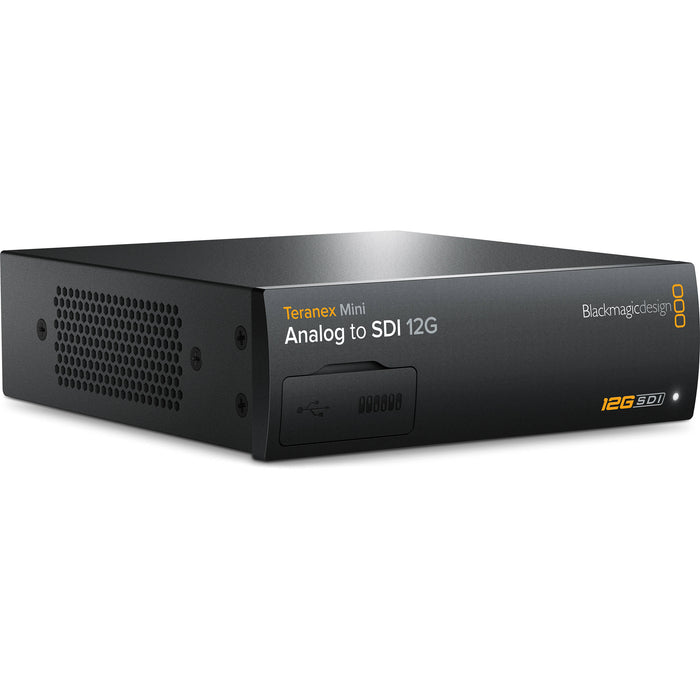 The Blackmagic Design Teranex Mini Analog to SDI 12G Converter is a compact, rectangular device with a matte black finish. The front panel features a USB port and ventilation grilles, while the rear panel includes component, S-Video, and composite analog video inputs, two 12G-SDI outputs, an Ethernet port, and XLR audio inputs. This design facilitates professional video and audio signal conversion in broadcast and post-production environments.