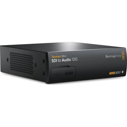 The Blackmagic Design Teranex Mini SDI to Audio 12G Converter is a compact, rectangular device with a matte black finish. The front panel features a USB port and ventilation grilles, while the rear panel includes a 12G-SDI input, a loop-through SDI output, balanced XLR audio outputs, unbalanced RCA audio outputs, an optical audio output, an Ethernet port, and a standard IEC power input. This design facilitates professional audio de-embedding from SDI signals in broadcast and post-production environments.