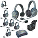Eartec HUB826 wireless intercom system with 2 single-ear and 6 dual-ear headsets, compact HUB base, multi-port charger, and carry case.