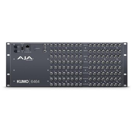 AJA KUMO 6464 compact 64x64 3G-SDI router with full-size BNC connectors, front-panel control buttons, and LCD screen in a 4RU rack-mounted unit.