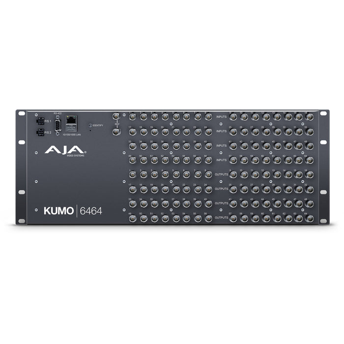 AJA KUMO 6464 compact 64x64 3G-SDI router with full-size BNC connectors, front-panel control buttons, and LCD screen in a 4RU rack-mounted unit.