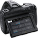 Blackmagic Design Pocket Cinema Camera 6K Pro with Canon EF mount, built-in ND filters, 5-inch HDR touchscreen, and dual native ISO for professional-quality video production.