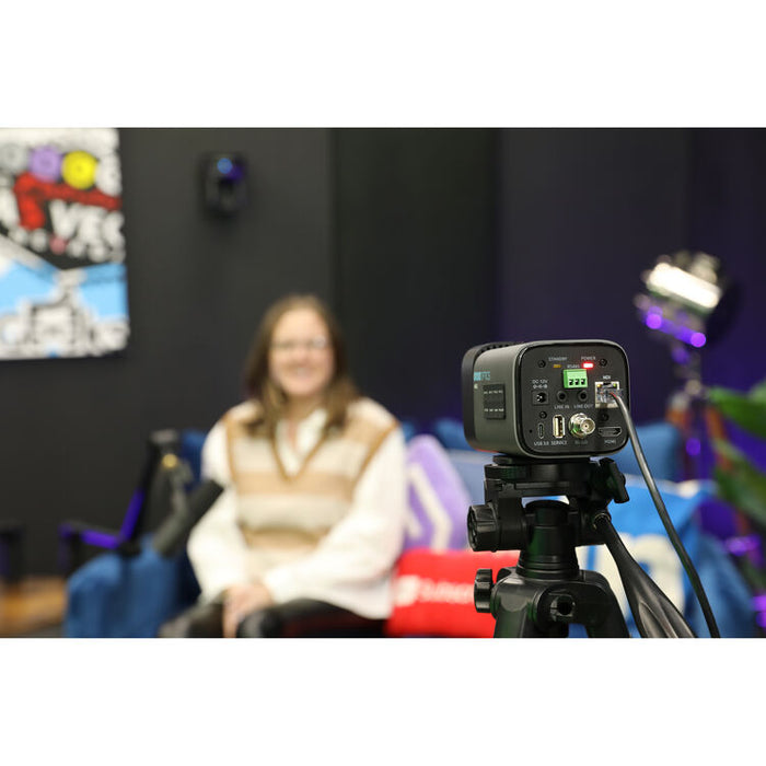 PTZOptics Studio 4K PTZ camera with 12x optical zoom in gray finish mounted for studio video production